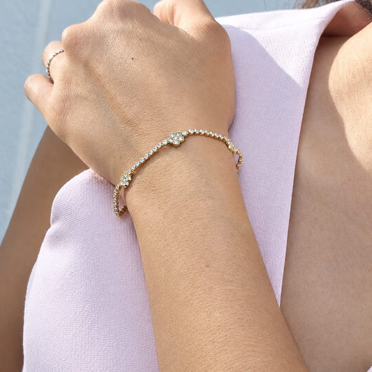 Pulsera tennis 3 flores zirconia en dorado